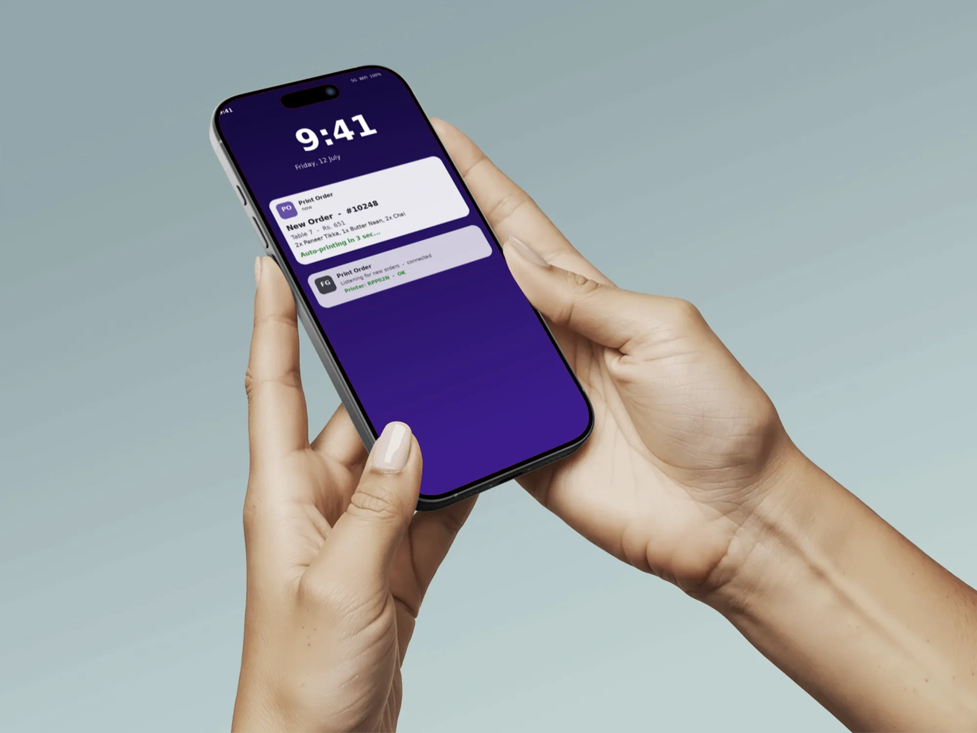 Hands holding a phone showing the Print Order lock screen auto-print notification for a new order
